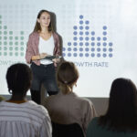 Employee at Arrow marketing services presenting strategies and techniques for better serving clientel in the Board room