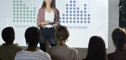 Employee at Arrow marketing services presenting strategies and techniques for better serving clientel in the Board room